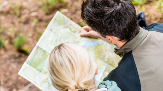 Man and woman looking over a hiking map